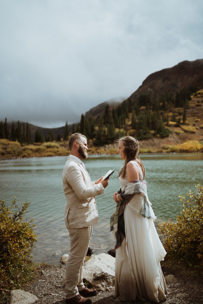 How to elope in Buena Vista. Couple eloping in buena vista, colorado. They spent the day hiking, reading vows at an alpine lake, and having a first look along the river. They had their ceremony at the collegiate peaks with family and friends. An adventure elopement in buena vista up cottonwood pass. 