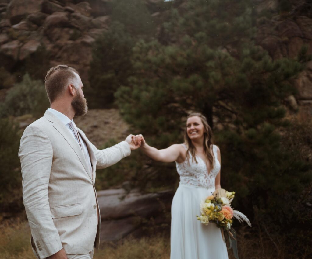 Emily and Clay started their elopement day at the river in Buena Vista where they took gloomy portraits before their hike.