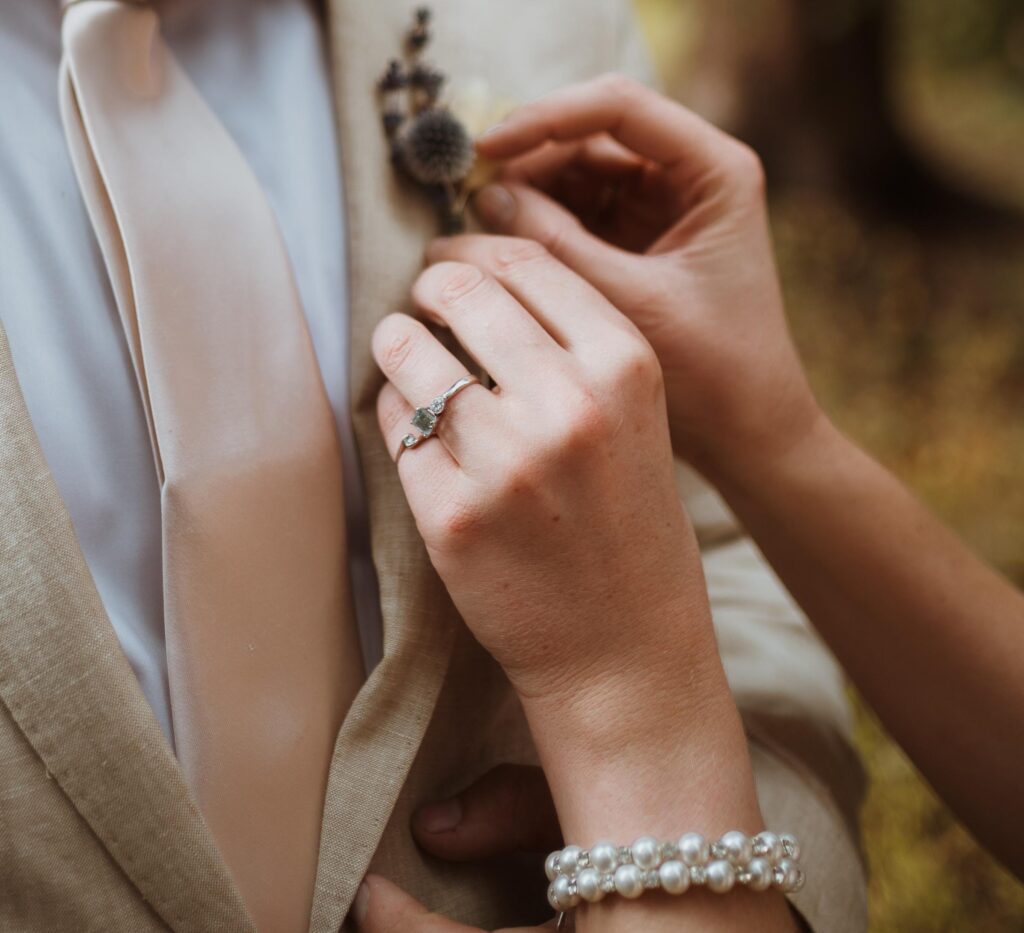 Emily has an aquamarine engagement ring from Buena Vista that clay mined for her. They took photos on their elopement day with the ring as a reminder of its significance.