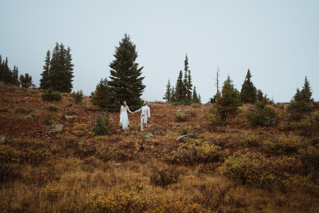 Hiking elopement in Buena Vista in the fall. Adventure wedding in Colorado Rocky Mountains.
