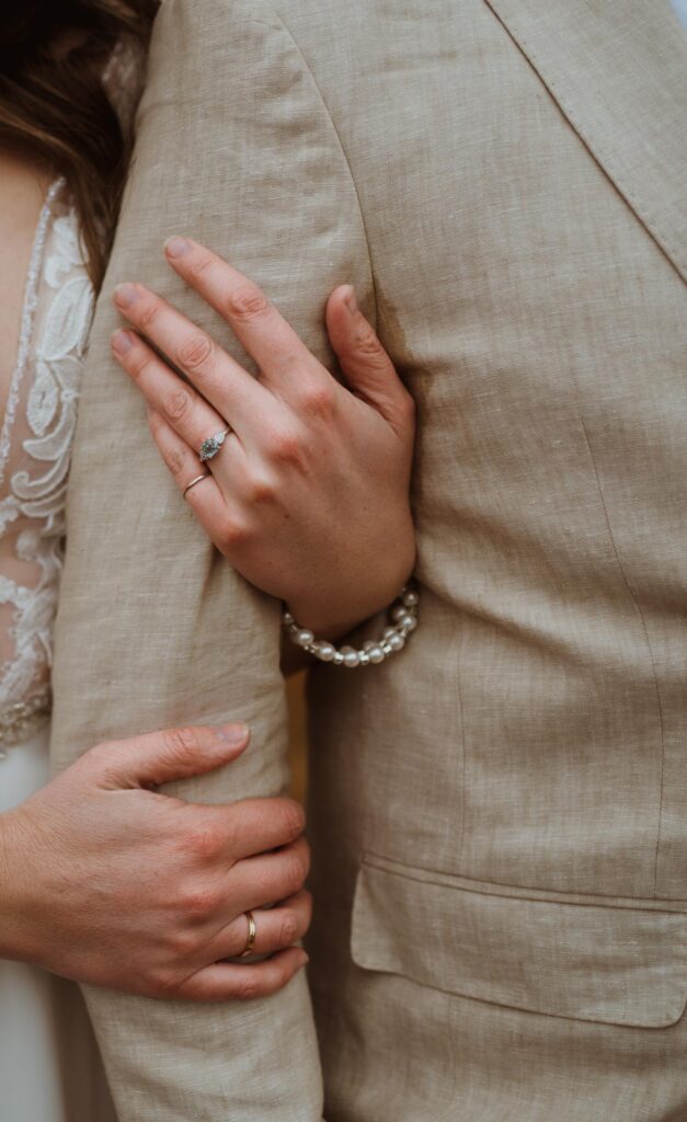 Emily has an aquamarine engagement ring from Buena Vista that clay mined for her. They took photos on their elopement day with the ring as a reminder of its significance.