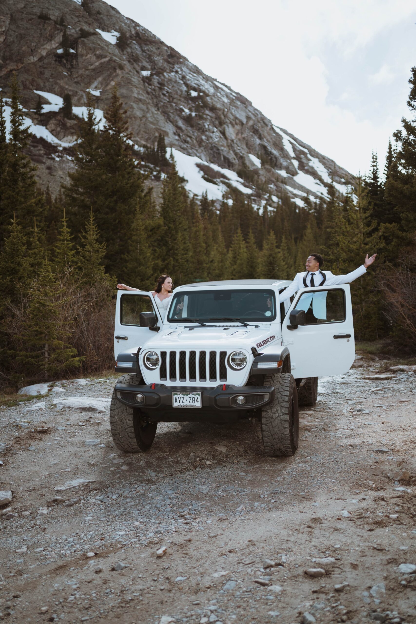 off-roading breckenridge elopement adventure. vows at a hidden waterfall, followed with off roading to alpine lakes and mountain passes. summer mountain elopement with private vows.