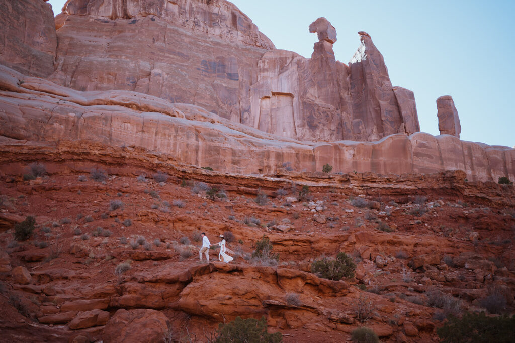 how to plan an elopement in moab and arches national park. adventure weddings by sydney mcrae photo in iconic landscapes around the united states. the best desert elopement inspiration.