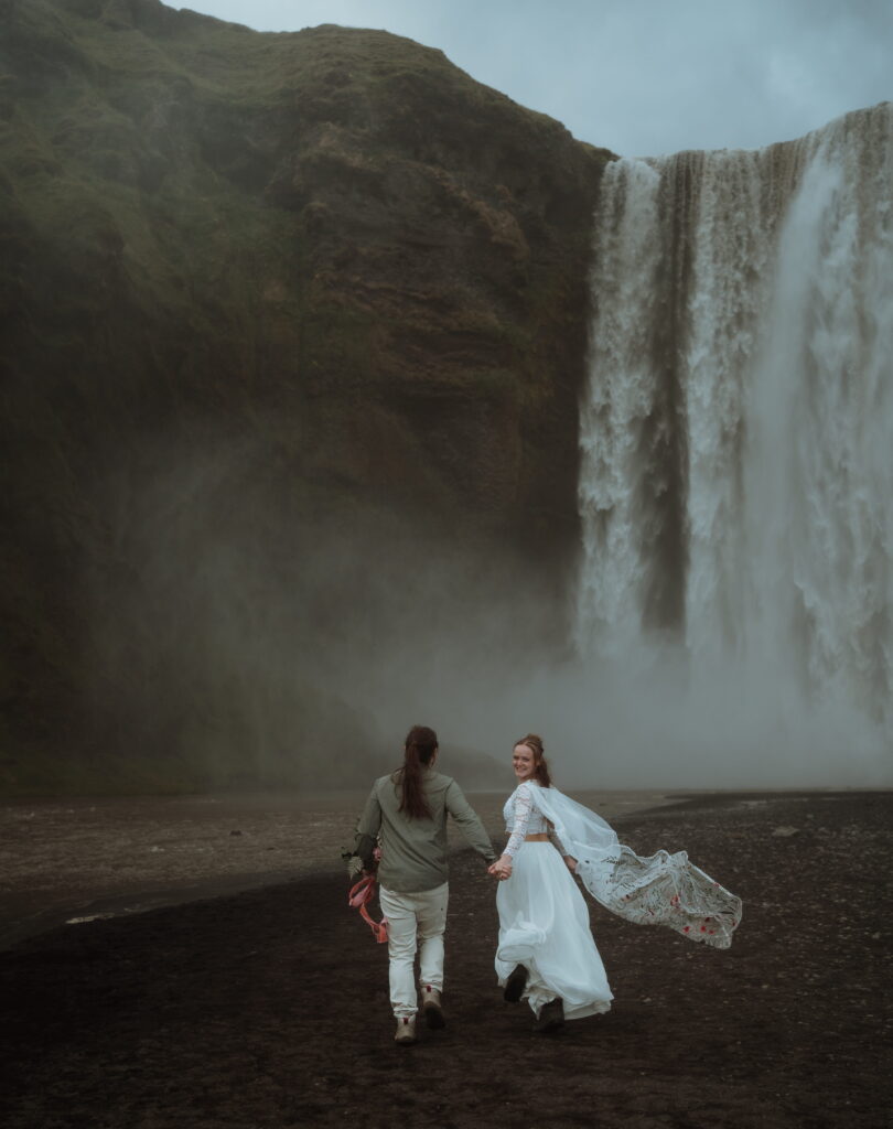The couple hiked and off roaded on their elopement day. we went to waterfalls, canyons, and overlooks. black sand beach, the basalt columns, and more. elopement photography for adventurers.