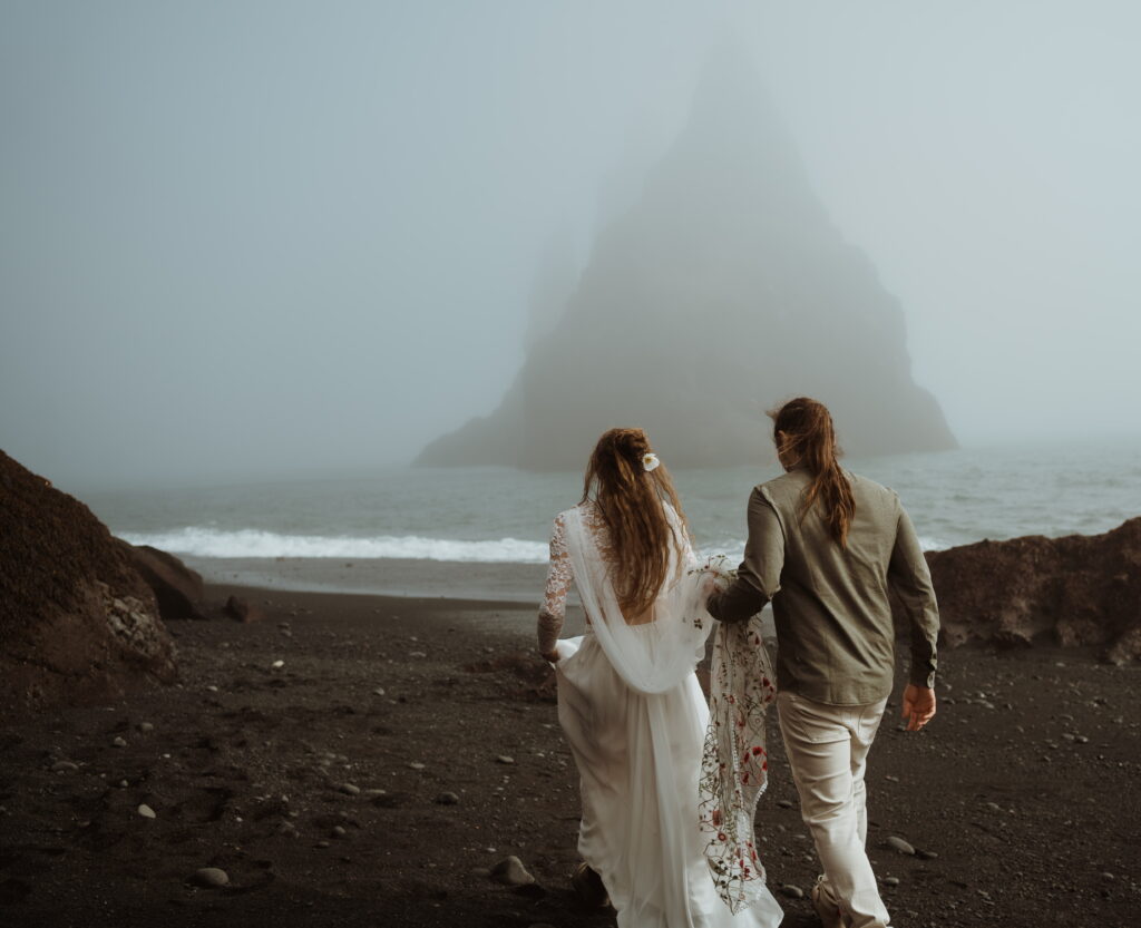Off roading adventure in the Icelandic Highlands. The couple said their vows overlooking the mountains. Hiked to a hidden waterfall on the way. Stopped at a river for photos. Remote wedding locations. Adventure wedding photographer.