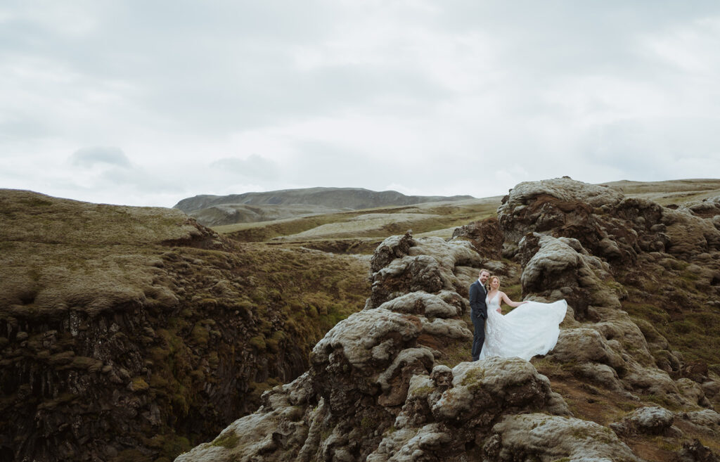 his Iceland adventure elopement was one for the books! Jess wore a stunning mountain elopement dress and looked incredible in the elopement photos! See tons of outdoor elopement outfit, elopement mountains, bride and groom poses, and romantic elopement wedding dress. 