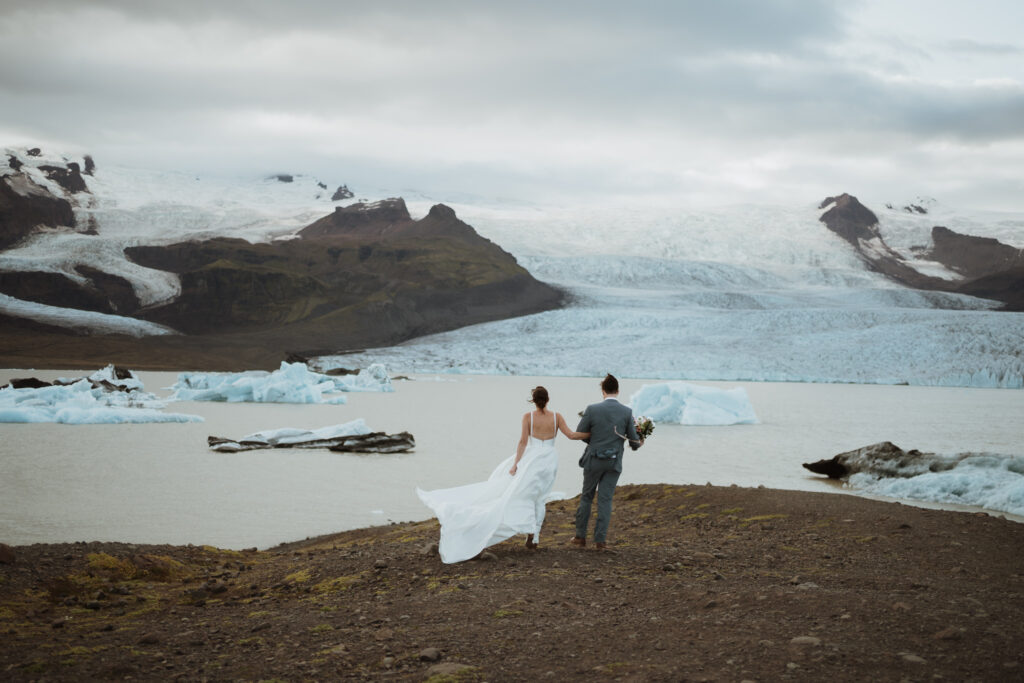 Jess & Rob's romantic elopement in Iceland was filled with Iceland wedding colors and Iceland wedding ideas. Get inspired by iceland wedding ceremony, iceland elopement winter, elopement wedding iceland and mountain wedding dress.
