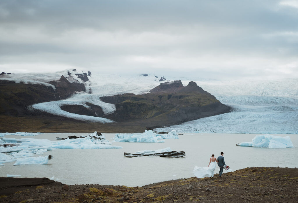 Jess & Rob's romantic elopement in Iceland was filled with Iceland wedding colors and Iceland wedding ideas. Get inspired by iceland wedding ceremony, iceland elopement winter, elopement wedding iceland and mountain wedding dress.